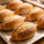 Freshly baked bolillo rolls baking 202609010253